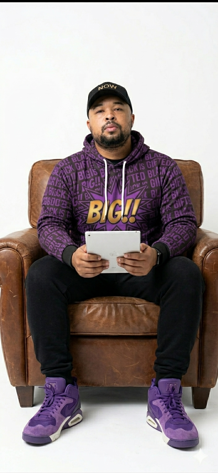 Elisha Carter, founder of EC Hustles, seated in a leather chair wearing a purple BIG!! hoodie and purple Nikes